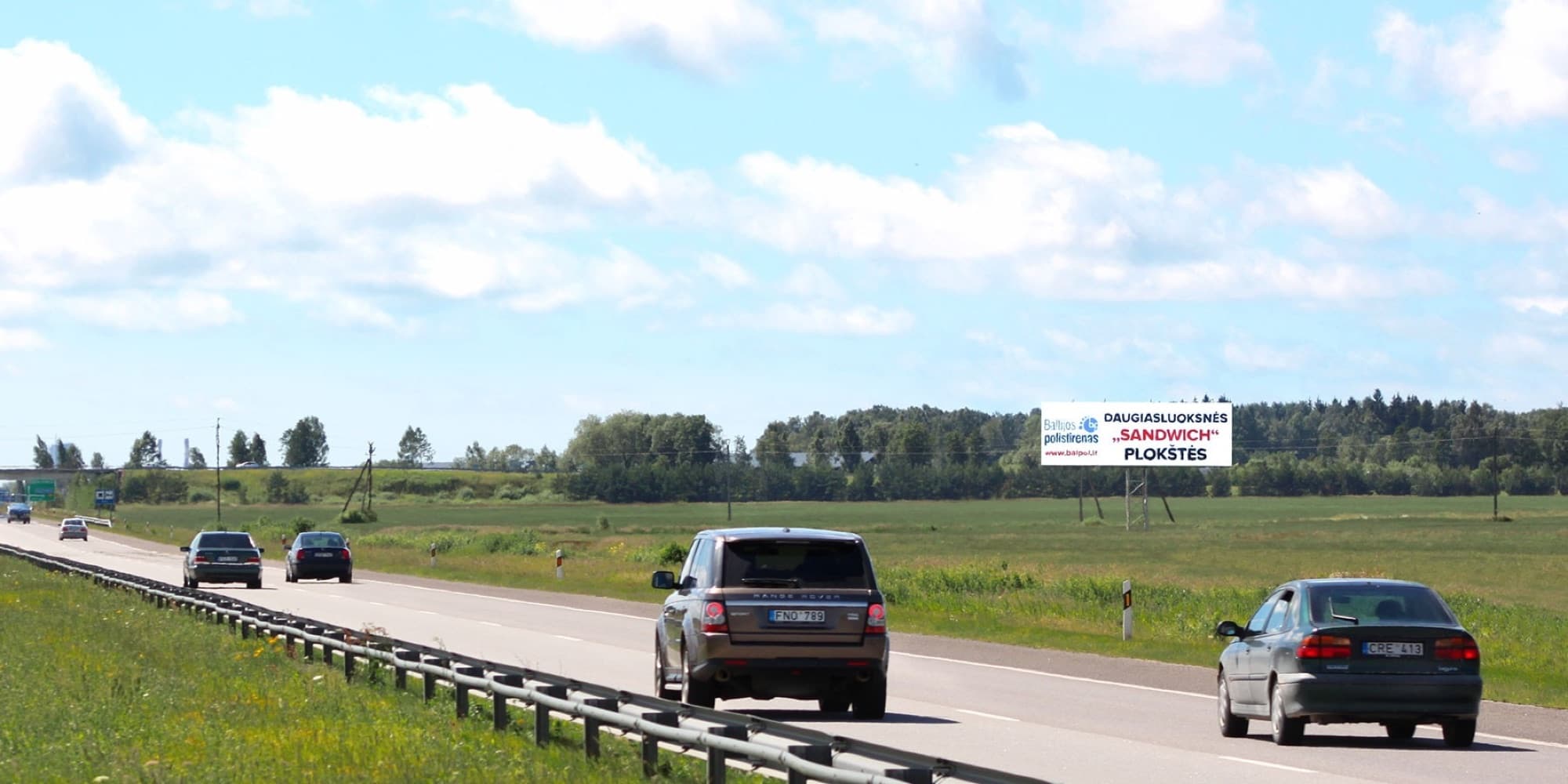 Autopista A1, Kaunas - Klaipėda (lado derecho), 297 km desde Vilna — Valla publicitaria Pagrindiniai keliai