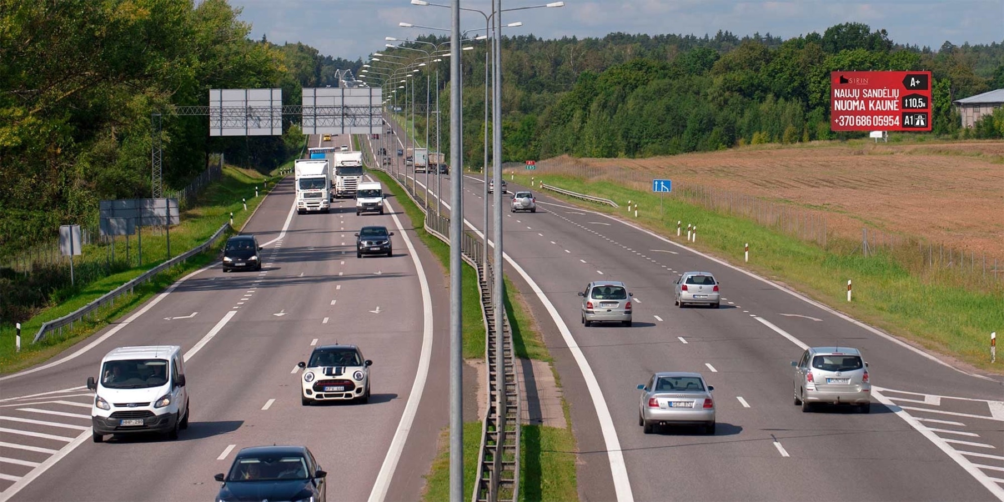 A1 motorway, Kaunas - Vilnius, 80 km from Vilnius — Advertising stand Pagrindiniai keliai