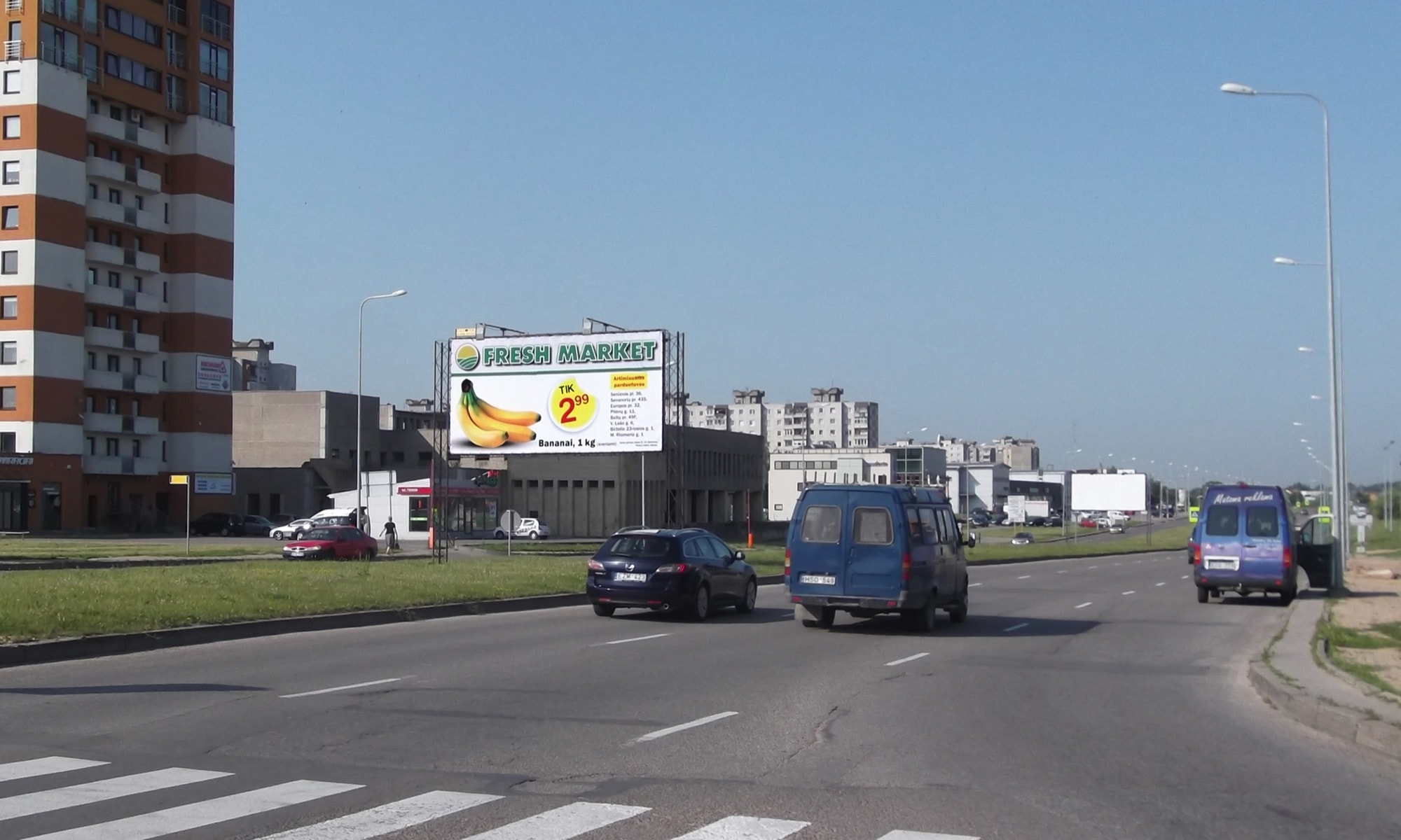 Reklamos stendas Baltų pr. ir Žemaičių pl. sankryža, Kaunas (B pusė) — Reklamos stendas Kaunas