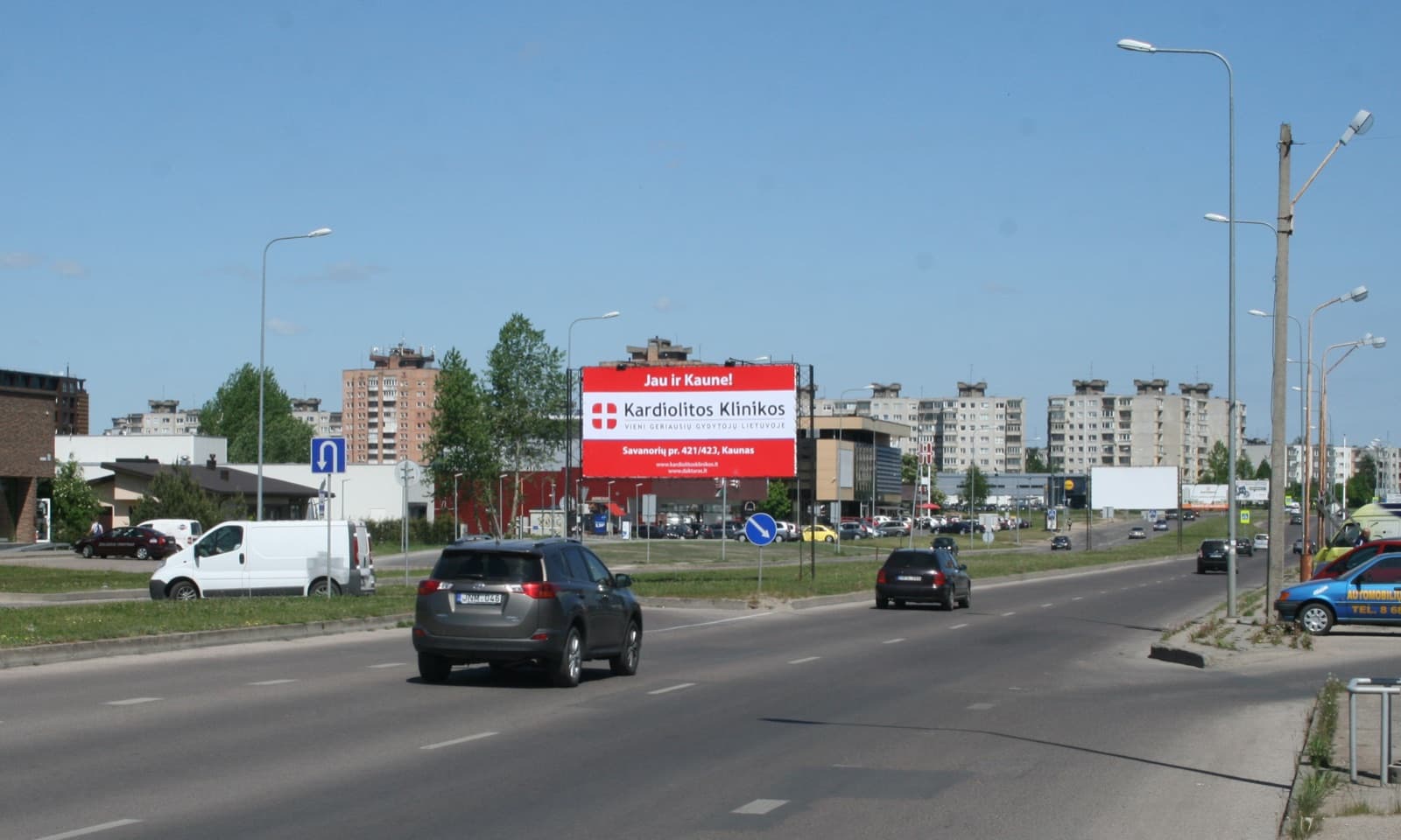 Reklameplakat ved Baltų pr, ved indkøbscentret "BALTAI", Kaunas (A-side) — Reklamos stendas Kaunas