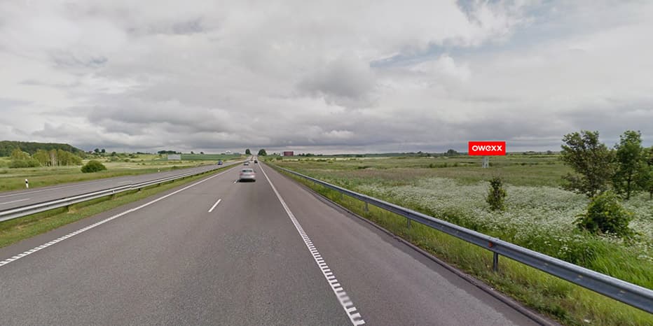 Tablica reklamowa Kaunas – Wilno, 53 km do Wilna, po prawej stronie