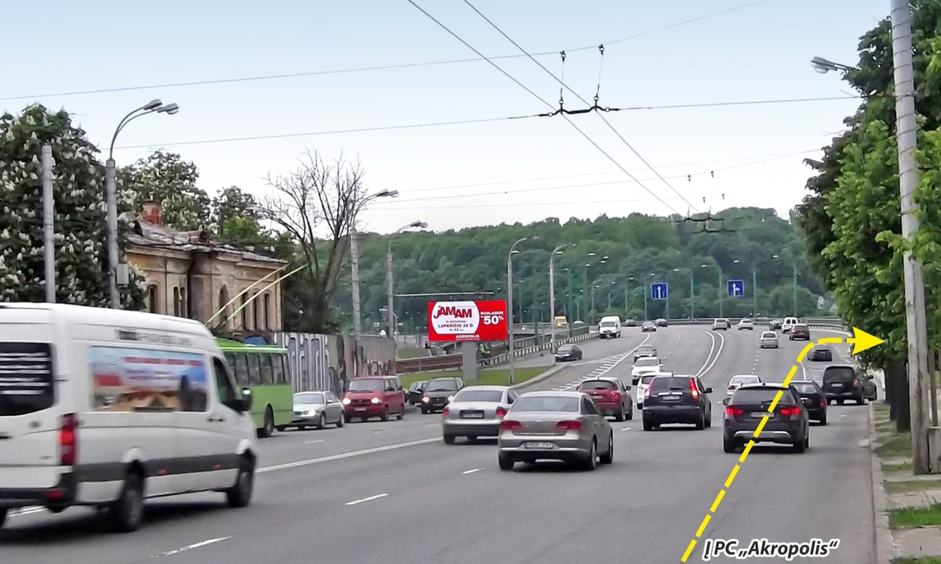 Reklamos stendas M.K.Čiurlionio g. ir Kaunakiemio g. sankryža, netoli Kaunakiemio g. įvažos, Kaunas (A pusė) — Reklamos stendas Kaunas