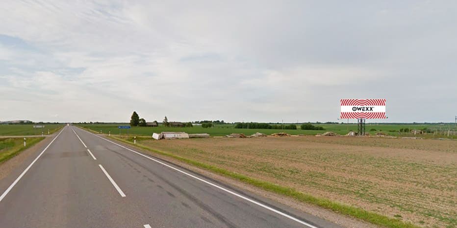 Reklamskylt Via Baltia, Kaunas - Panevėžys, 18 km från Kaunas (höger sida)