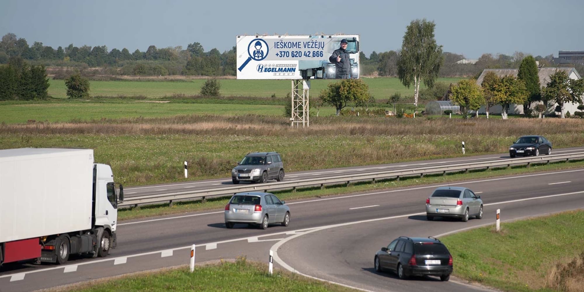 Reklamskylt på Via Baltica, Marijampolė–Kaunas (höger sida), 5 km från Kaunas