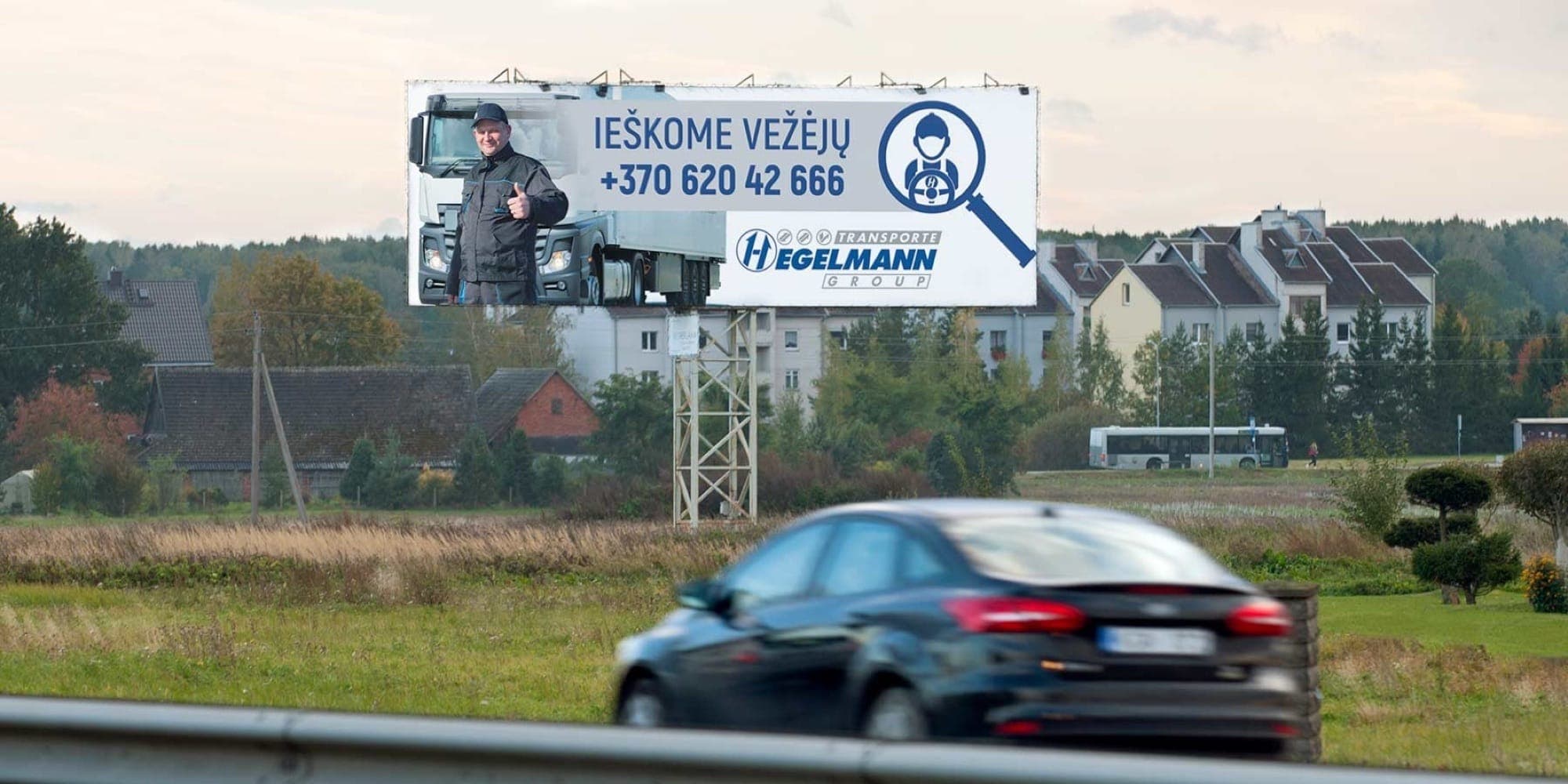 Reklamni pano na cesti Via Baltica, Kaunas–Marijampolė (leva stran), 5 km od Kaunasa