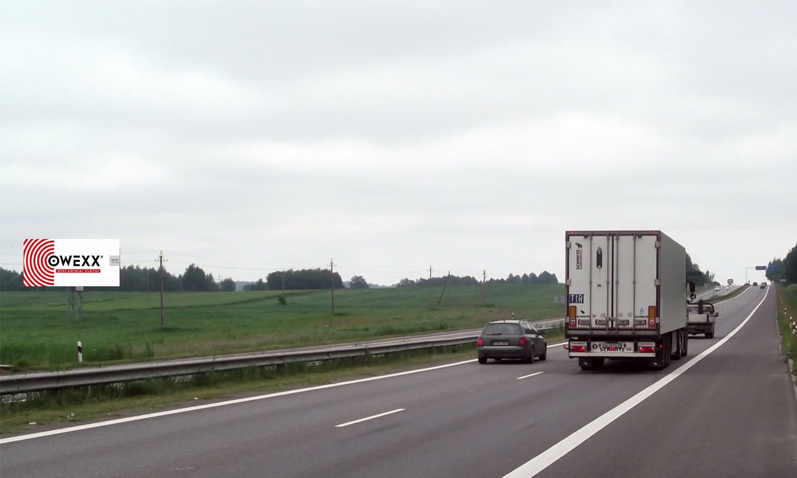 Magistrale reclamebord op 65 km van Vilnius, nabij Baniškės (zijde B)