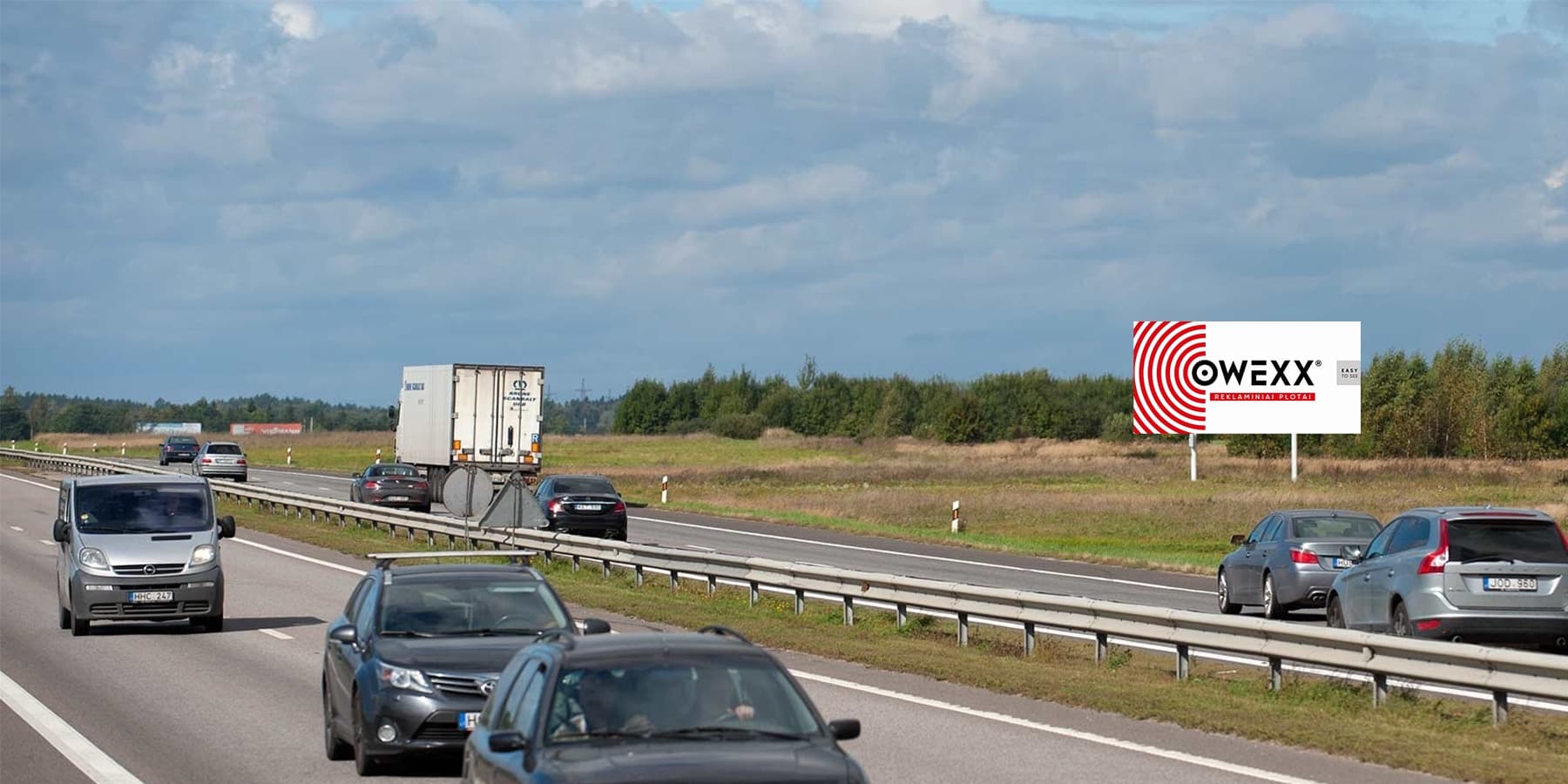 Reklamní billboard na dálnici A1, Vilnius – Kaunas (pravá strana), 76 km od Vilniusu