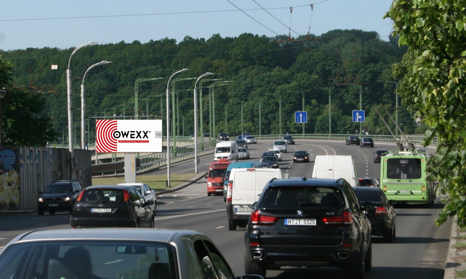 Reklamos stendas M.K.Čiurlionio g. ir Kaunakiemio g. sankryža, netoli Kaunakiemio g. įvažos, Kaunas (A pusė)