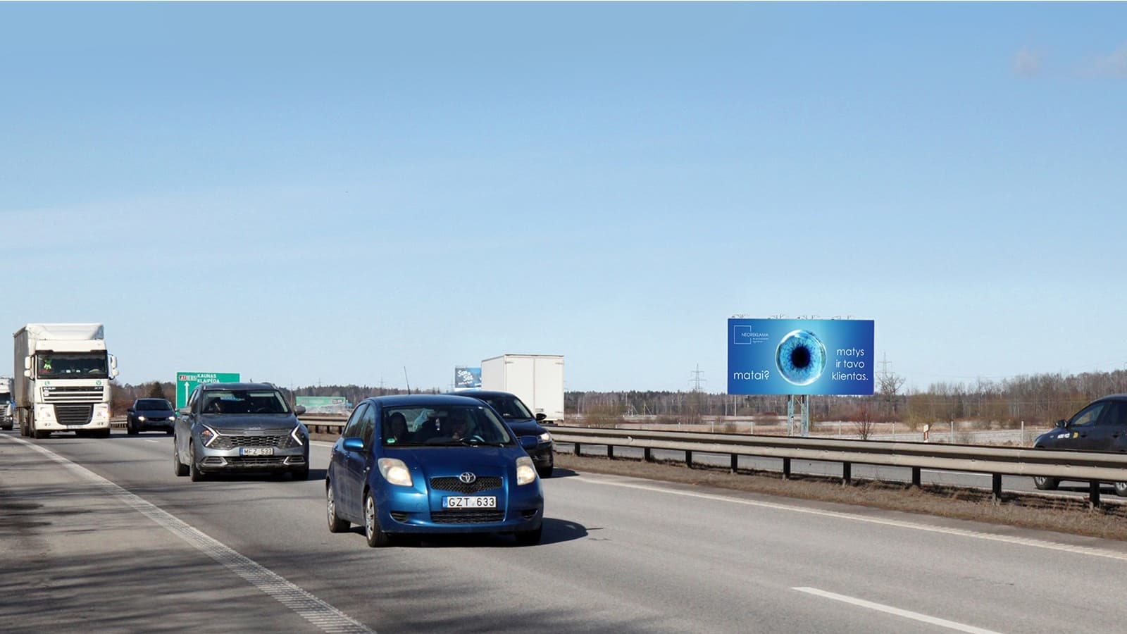 Panneau publicitaire sur l'autoroute A1, Vilnius – Kaunas (côté droit), à 78 km de Vilnius — Panneau publicitaire Pagrindiniai keliai